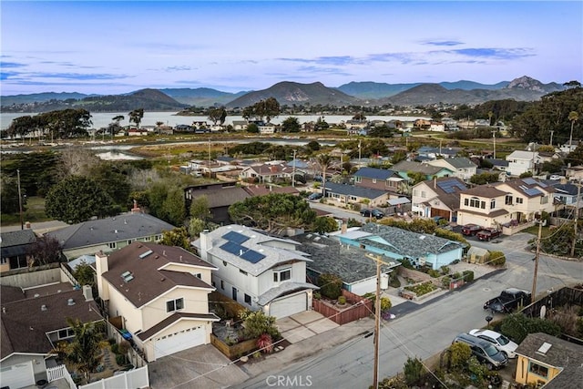 drone / aerial view featuring a residential view and a mountain view