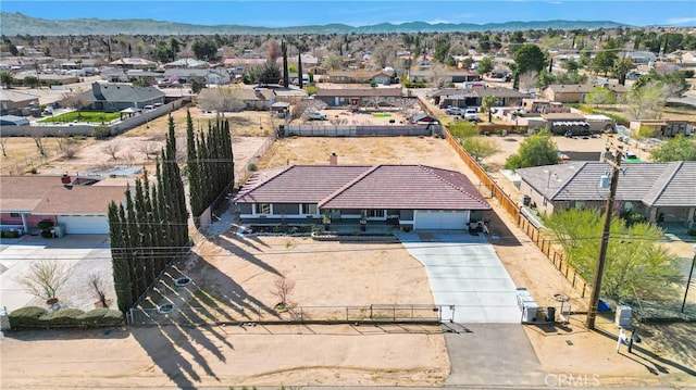 bird's eye view featuring a residential view and a mountain view