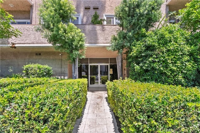 entrance to property featuring french doors