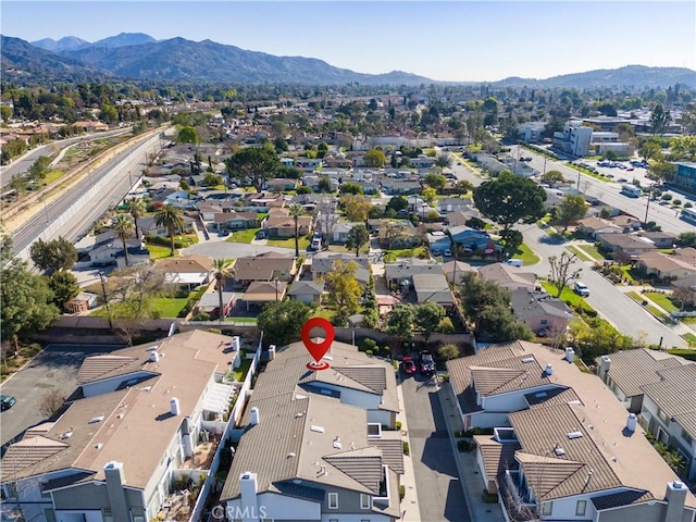 birds eye view of property with a residential view and a mountain view