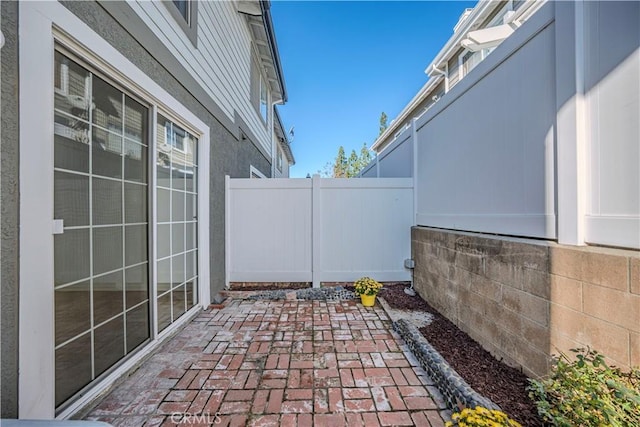 view of patio / terrace featuring fence