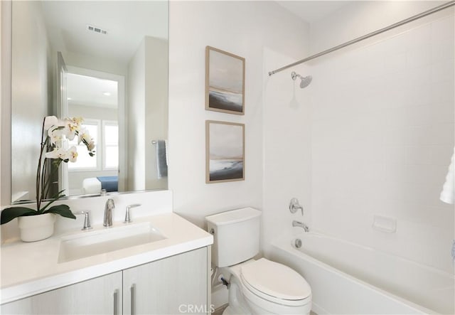 full bathroom with visible vents, toilet, ensuite bathroom, washtub / shower combination, and vanity