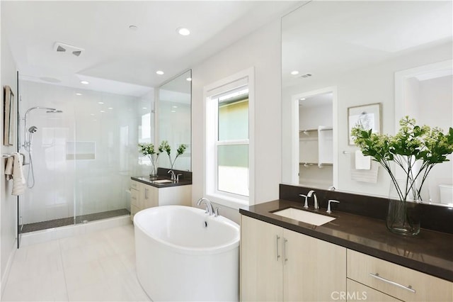 full bath with vanity, visible vents, a soaking tub, recessed lighting, and a shower stall