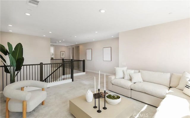 living room featuring light colored carpet, recessed lighting, visible vents, and baseboards