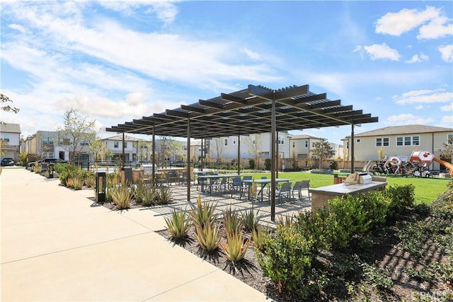 surrounding community with a residential view, a pergola, and a yard