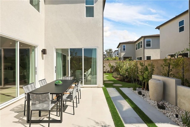 view of patio featuring fence