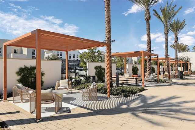 view of patio / terrace featuring a pergola and fence