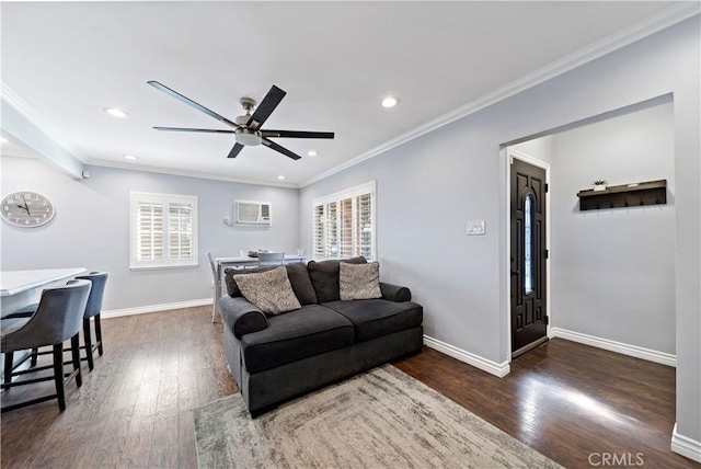 living room with baseboards, ornamental molding, hardwood / wood-style floors, and a healthy amount of sunlight