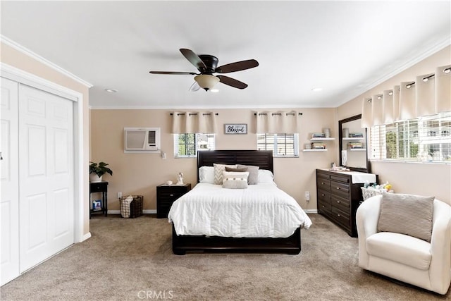 bedroom featuring a ceiling fan, baseboards, a wall mounted AC, carpet, and crown molding