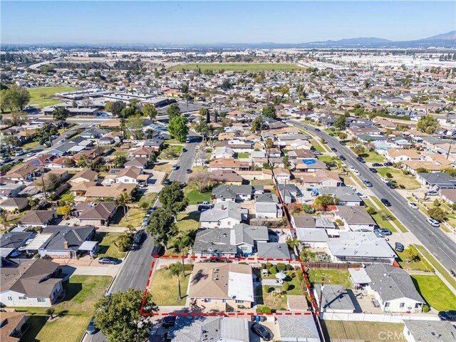 birds eye view of property with a mountain view and a residential view