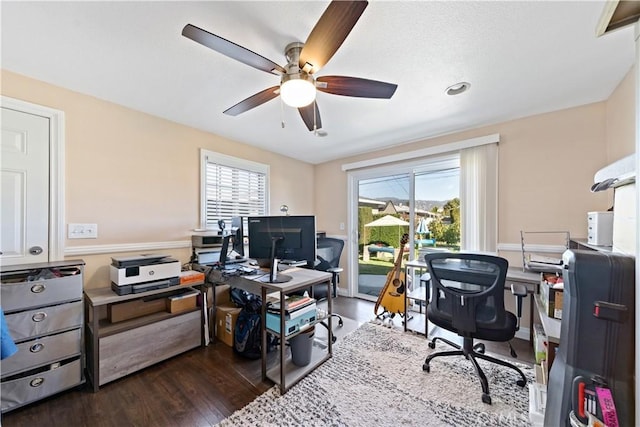 office with dark wood-style floors and ceiling fan