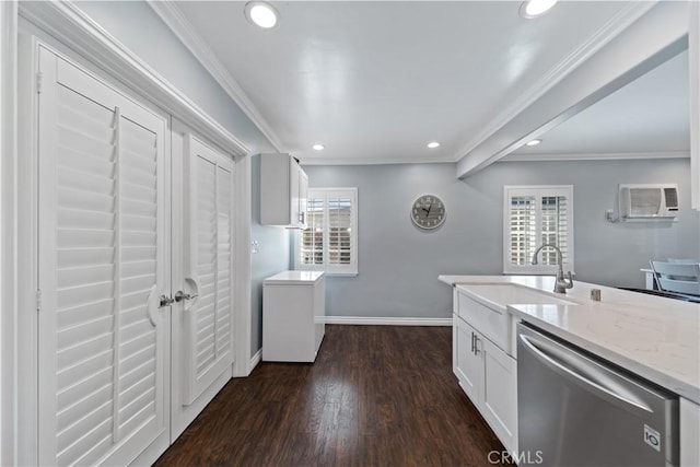 kitchen with a wall unit AC, a sink, ornamental molding, dishwasher, and dark wood finished floors