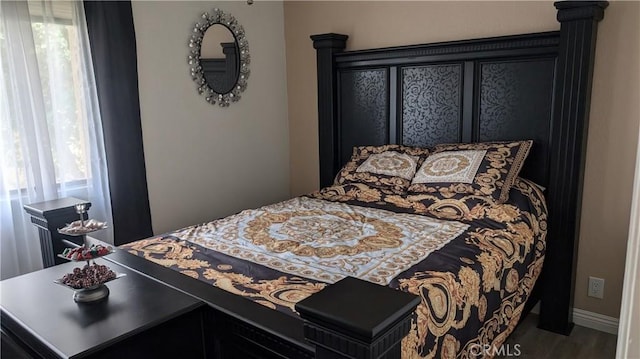 bedroom featuring wood finished floors