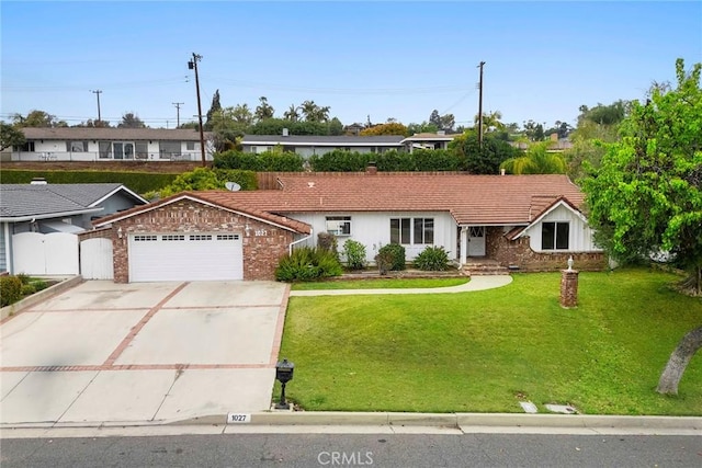 ranch-style house with driveway, a garage, a tile roof, fence, and a front yard