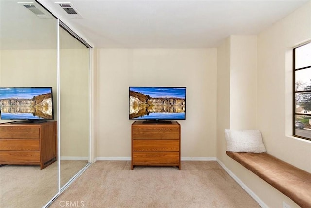 sitting room featuring carpet, visible vents, and baseboards