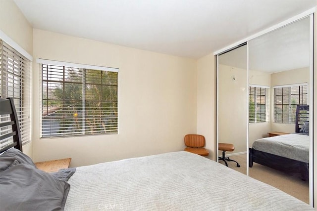 carpeted bedroom featuring a closet