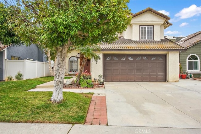 view of front of home featuring a garage, fence, a tile roof, driveway, and a front yard