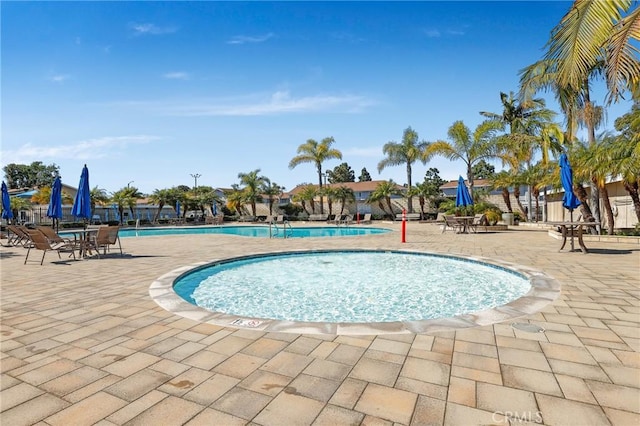 community pool with a patio