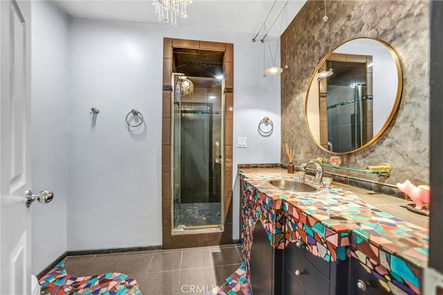 full bathroom with a shower stall, tile patterned flooring, and vanity