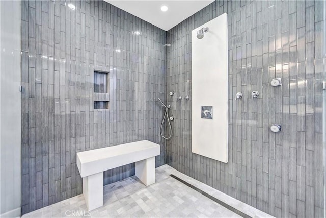 bathroom featuring tiled shower