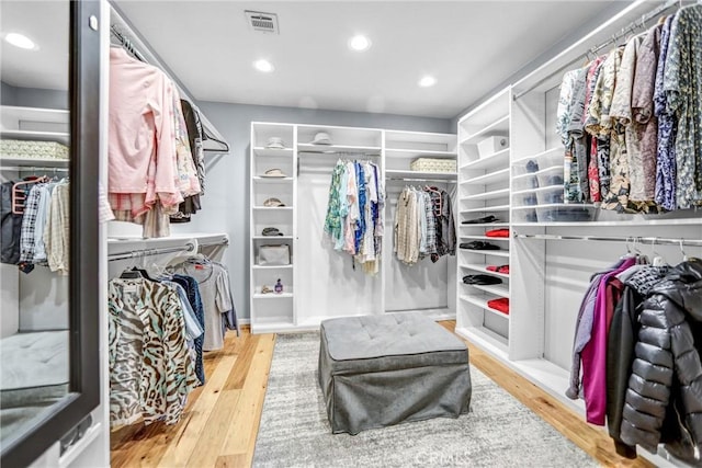 spacious closet with visible vents and wood finished floors