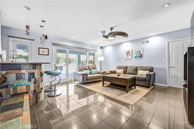 living room featuring ceiling fan, visible vents, french doors, and recessed lighting