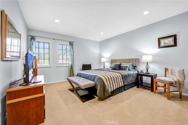 bedroom featuring multiple windows, recessed lighting, and light colored carpet