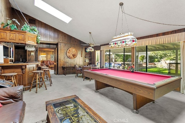 playroom with high vaulted ceiling, wooden walls, light carpet, billiards, and visible vents