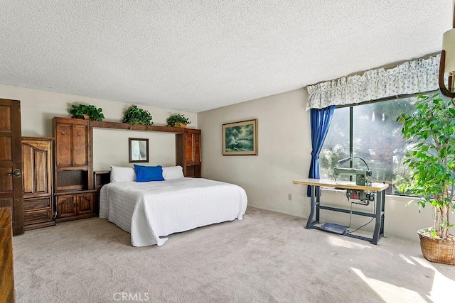 carpeted bedroom with a textured ceiling