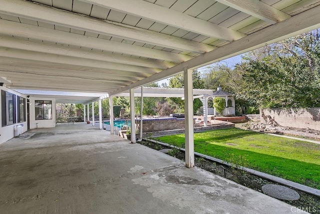 view of patio featuring a fenced in pool