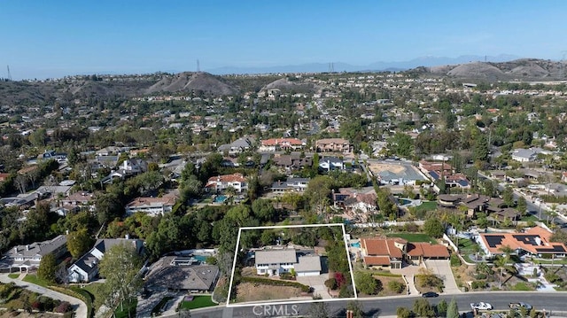 bird's eye view featuring a residential view and a mountain view