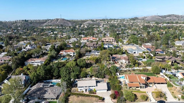 drone / aerial view featuring a residential view and a mountain view