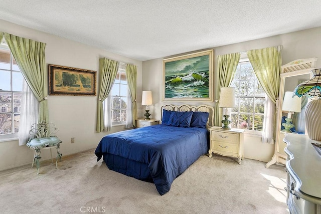 carpeted bedroom featuring a textured ceiling