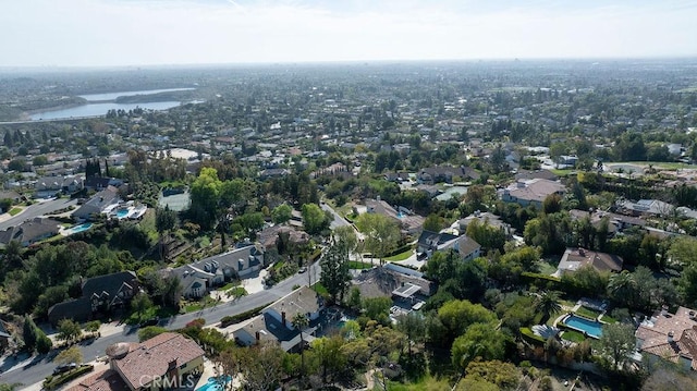 bird's eye view with a residential view and a water view