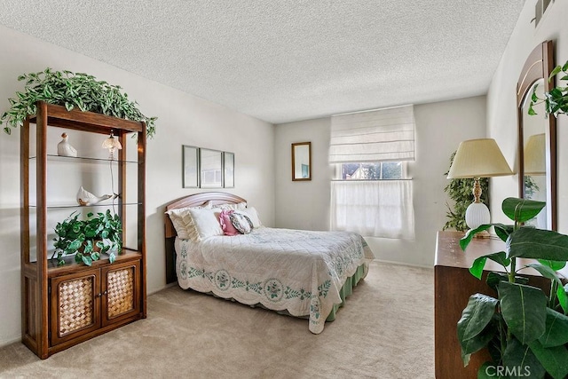 carpeted bedroom with a textured ceiling