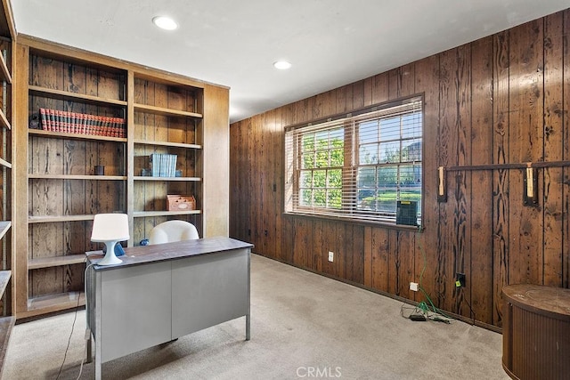 office area with recessed lighting, carpet flooring, and wooden walls