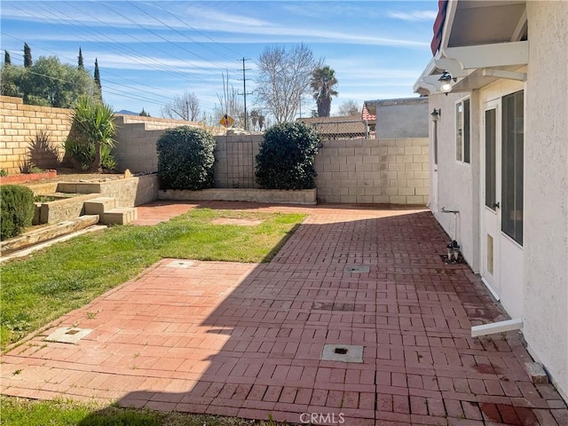 view of patio with a fenced backyard