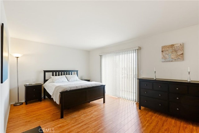 bedroom with light wood-type flooring