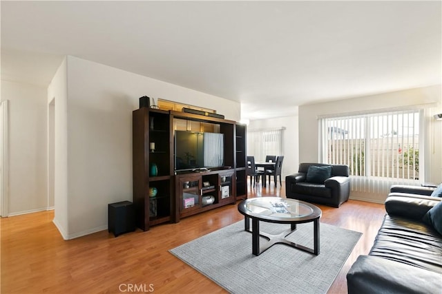 living room with light wood-style floors and baseboards