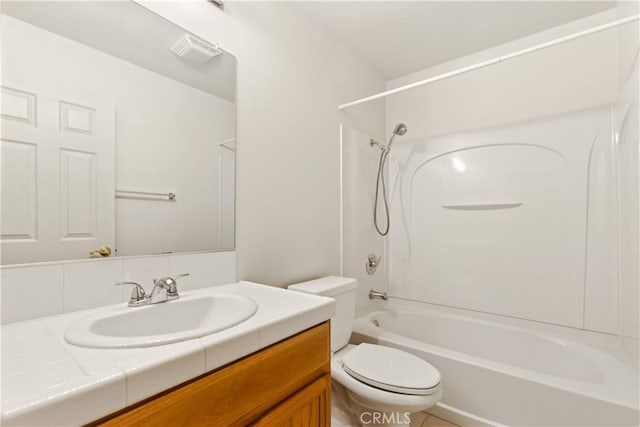 bathroom with visible vents, vanity, toilet, and bathing tub / shower combination