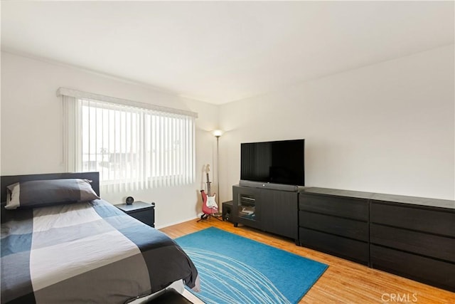 bedroom featuring light wood-type flooring