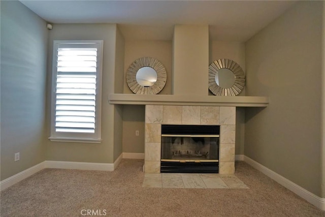 interior details featuring carpet, a fireplace, and baseboards