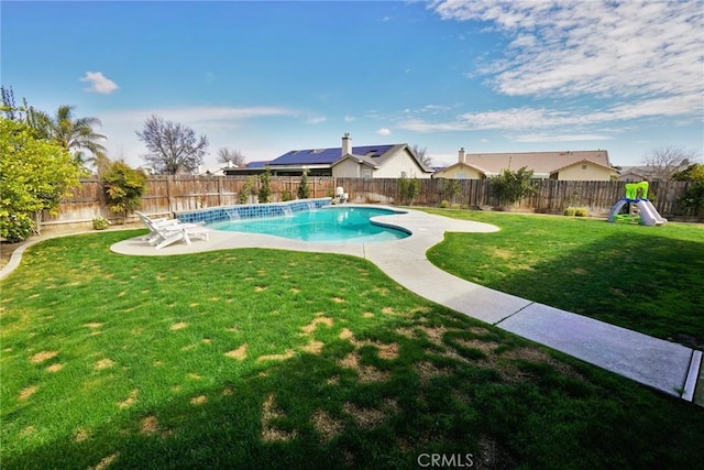 view of pool with a patio, a playground, a fenced backyard, a lawn, and a fenced in pool