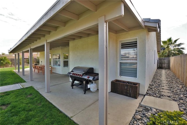 view of patio / terrace with area for grilling and a fenced backyard