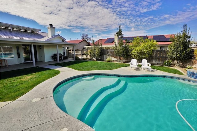 view of pool with a yard, a fenced backyard, area for grilling, and a patio