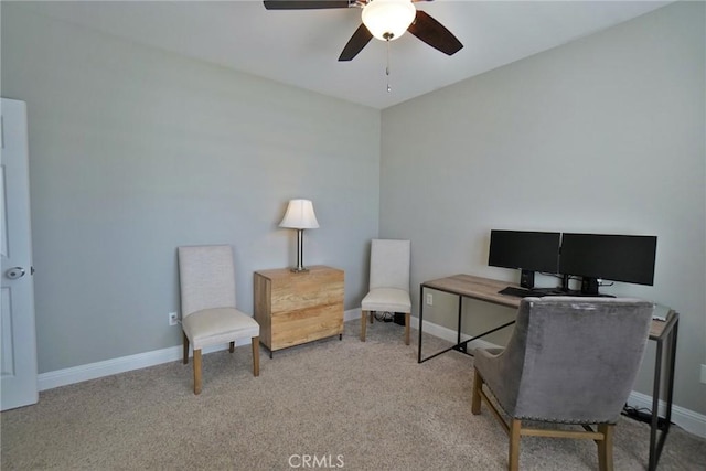 carpeted home office featuring a ceiling fan and baseboards