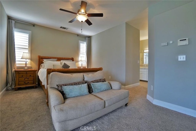 bedroom featuring light carpet, multiple windows, and visible vents