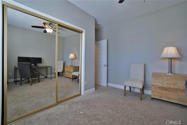 carpeted bedroom with a closet, ceiling fan, and baseboards