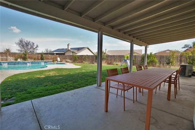 view of patio with a fenced backyard, outdoor dining area, and a fenced in pool