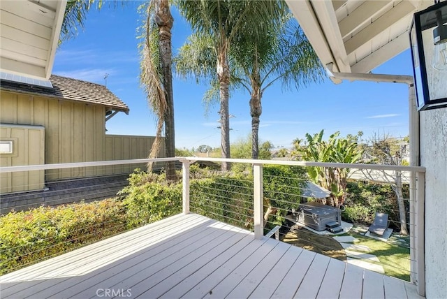 wooden deck featuring area for grilling